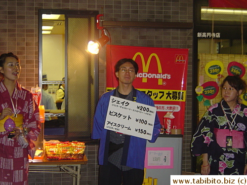 McDonald's staff in yukata selling their food on the street to join the festivity of the matsuri