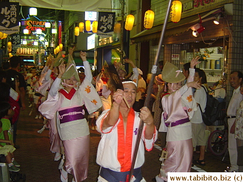 Women wear pretty kimonos in the matsuri