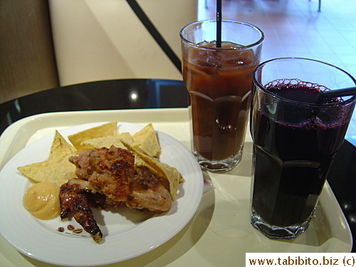 My afternoon tea set: very soft and tasty wings, nacho chips and grape juice, iced coffee for KL