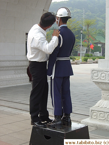 Luckily a staff helps him wipe his sweat off, and very carefully
