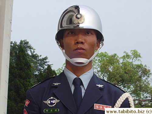The guards stand at their post in rain or shine.  This one is pouring sweat down his face and he can't even wipe it, poor fella!