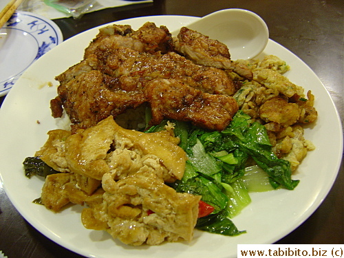 Pork chop over rice with cold side dishes.  I don't quite care for the cold tofu, vegies and stir-fried eggs, they remind me of left-overs
