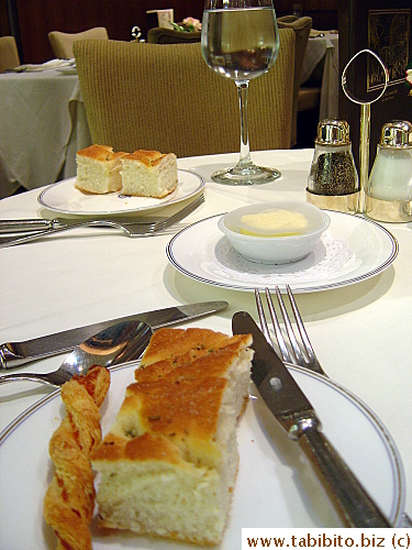 Table setting.  A lady came around to offer bread.  We chose focaccia and a curly flaky stick.  The focaccia with a crispy salty top and soft inside was awesome