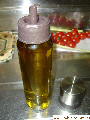 The second thing is this oil bottle.  It has a slanted groove which drains any dripping oil from the spout back to the bottle.  It solves the backflowing oil-all-over-the-bottle problem for me 