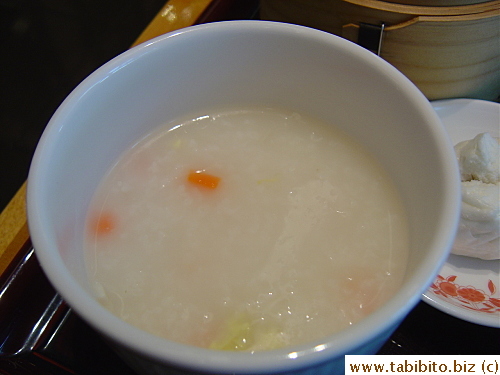 Plain congee with finely diced carrots and bamboo shoots and sliced baby corn